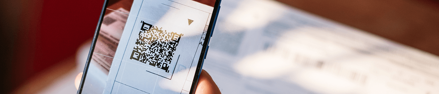 Man scanning QR with smartphone