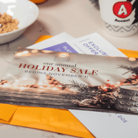 Image of an engaging holiday direct mail piece sitting on a table